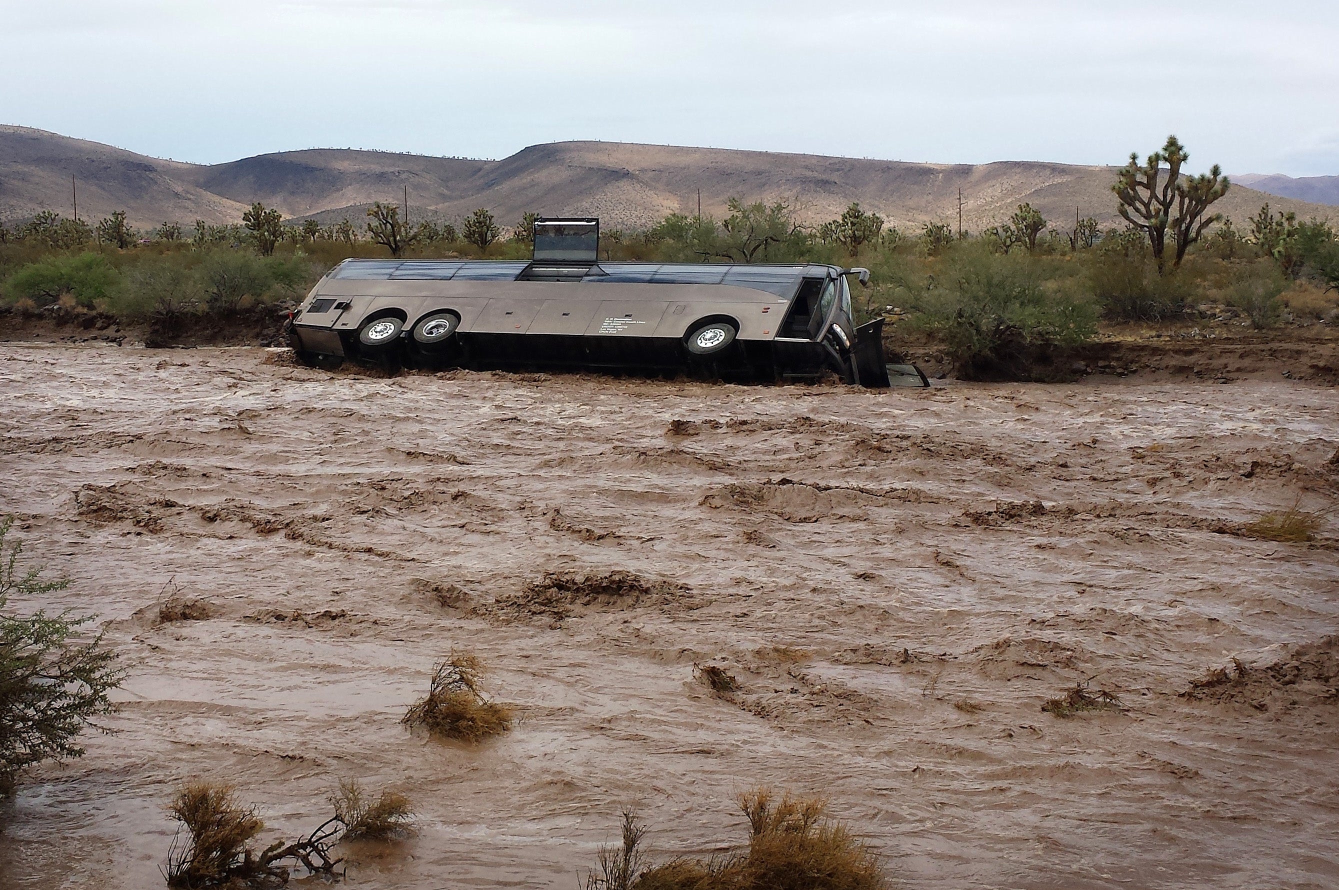 Tour bus swept away by Arizona floodwaters CBS News
