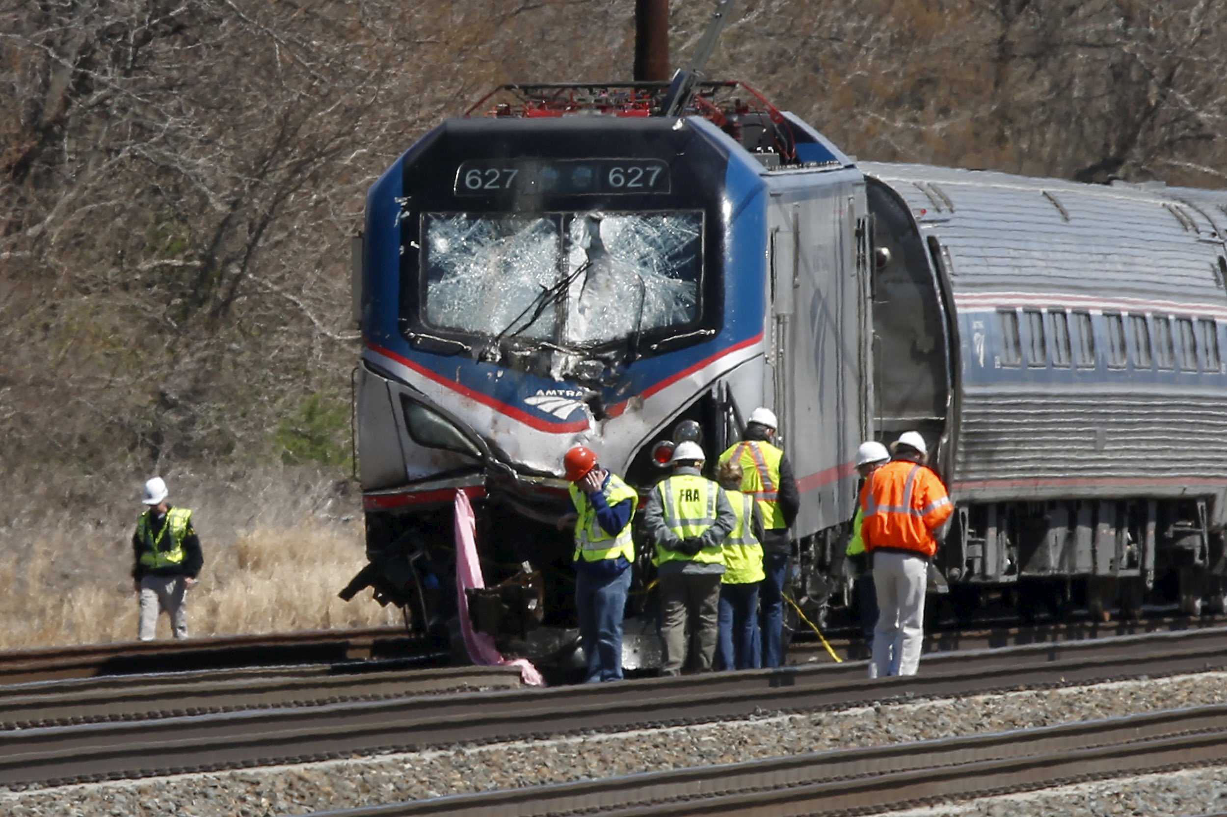Amtrak train struck backhoe at 106 mph in fatal derailment, officials