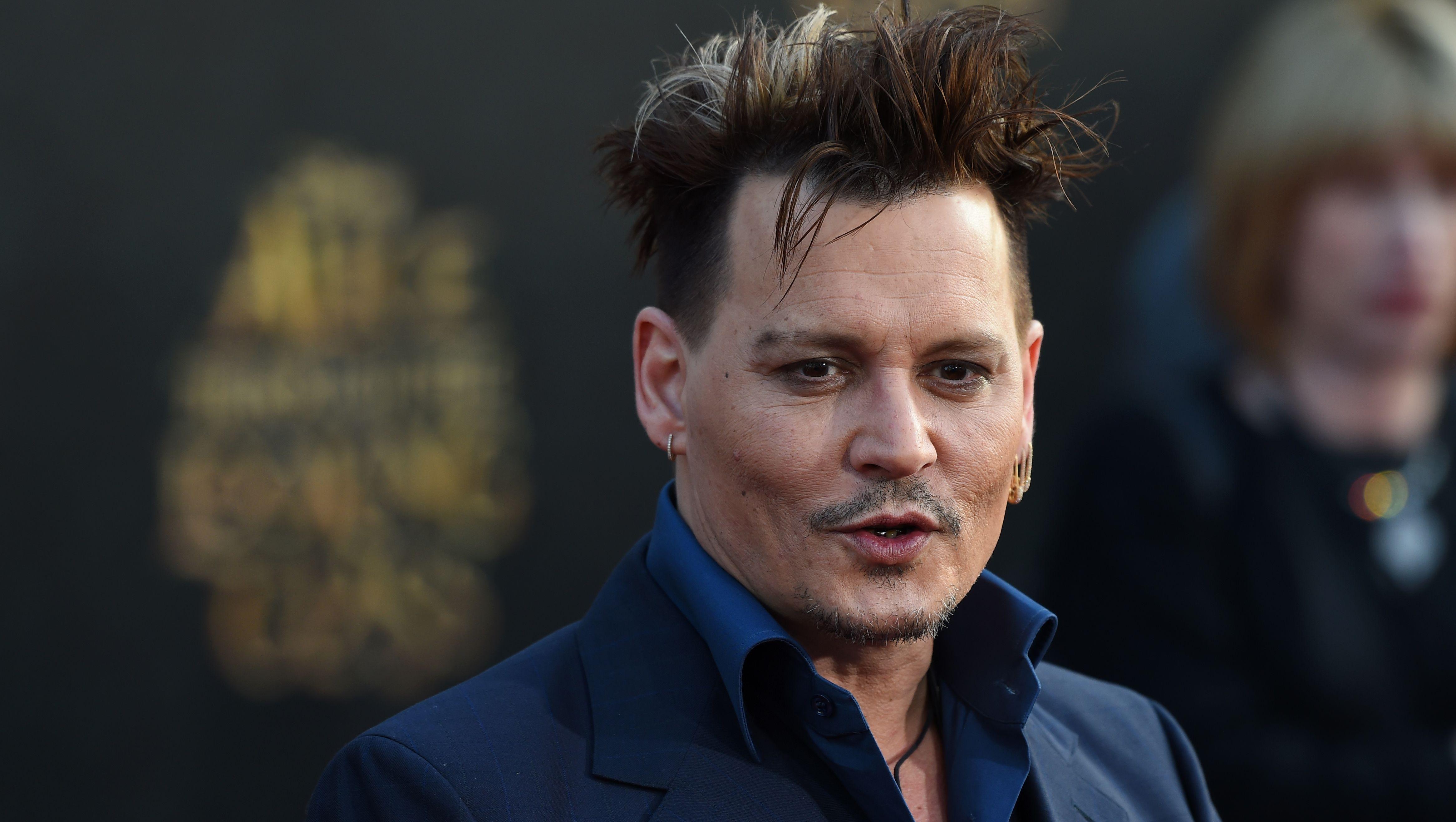 Johnny Depp sues ex-managers alleging millions in losses - CBS News