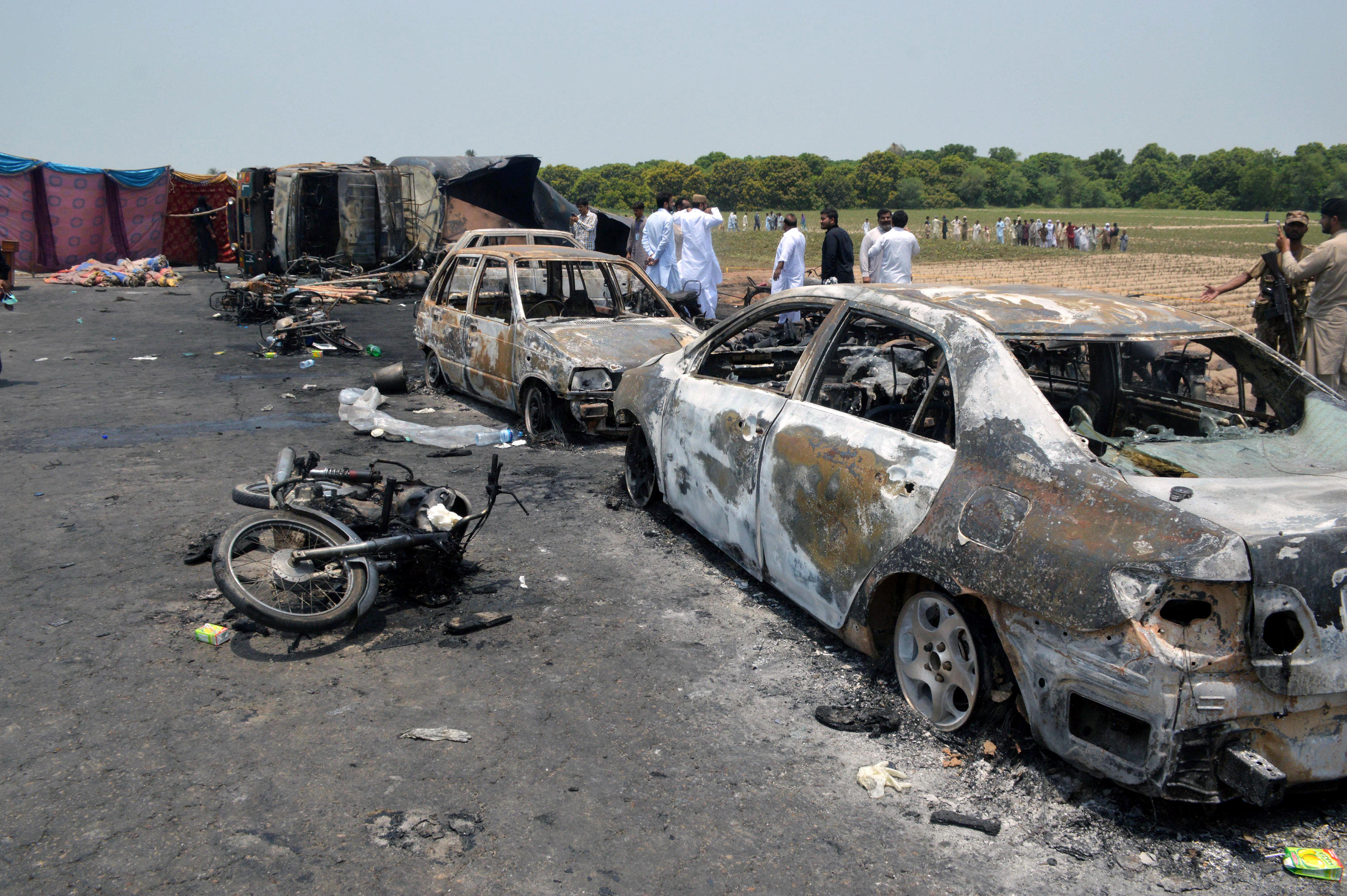 Oil tanker explodes in Pakistan, killing scores who rushed to accident