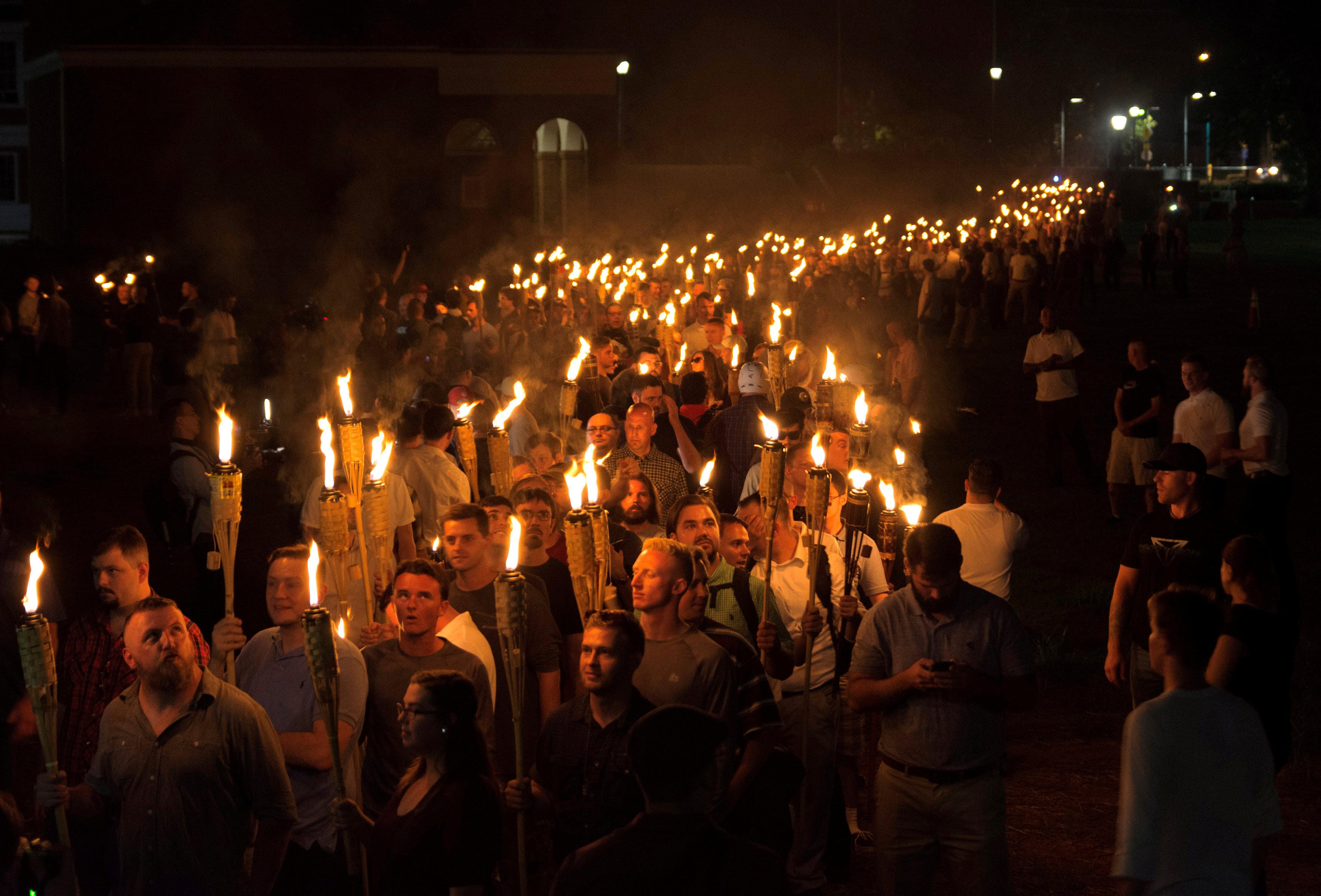 Torch-wielding white nationalists march through University of ...
