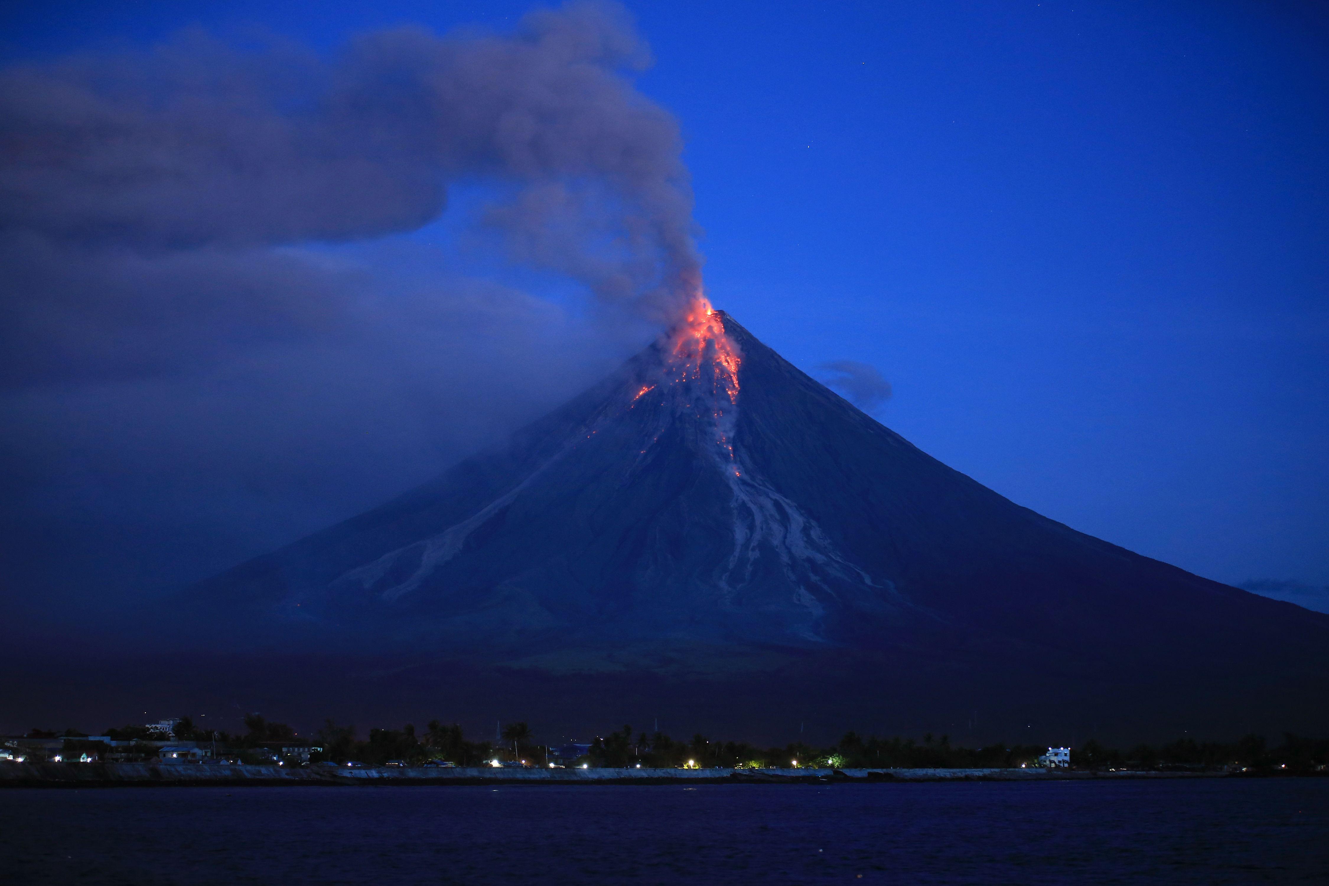 Philippines Mayon volcano forces more evacuations as lava shoots
