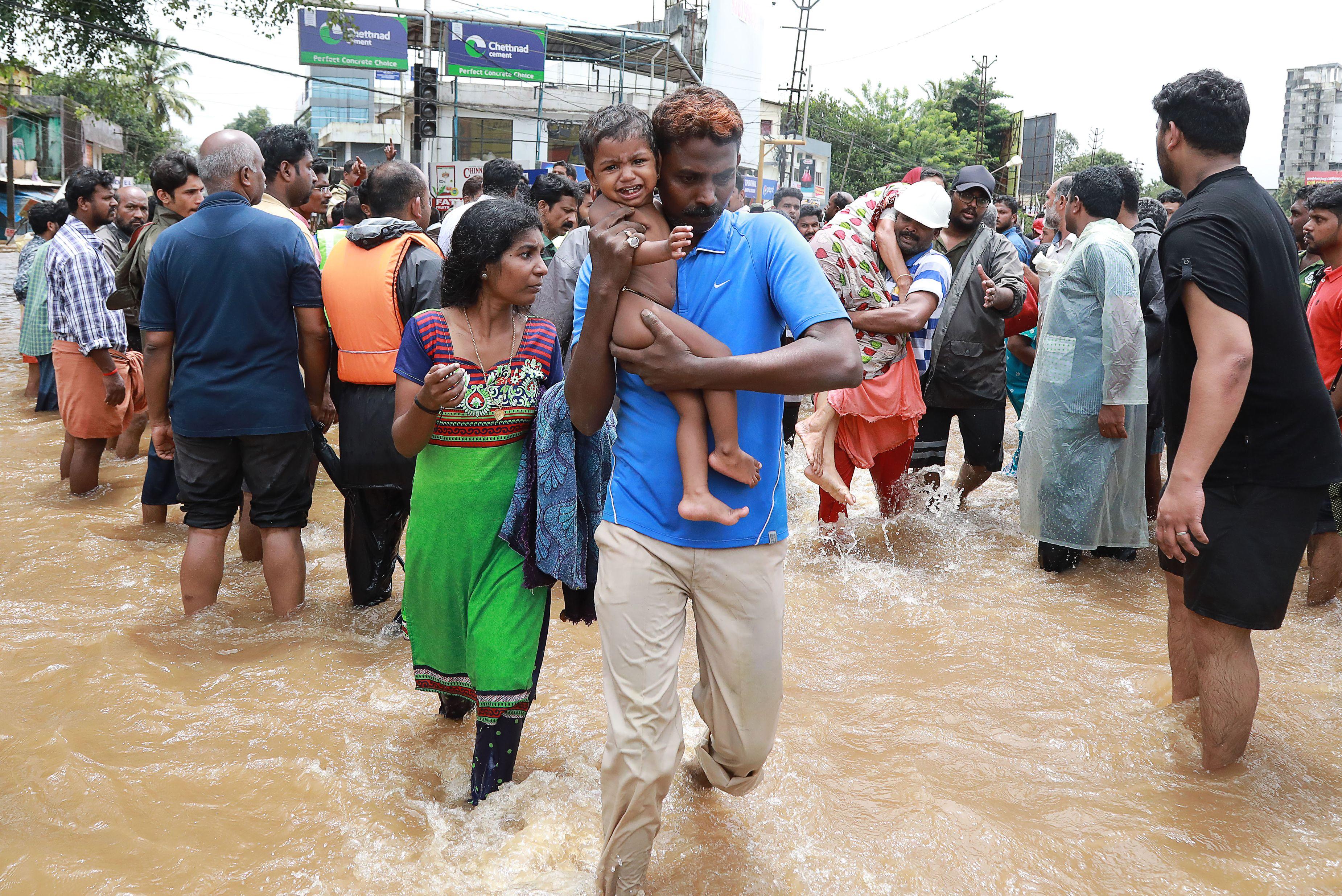 India floods ravage Kerala state, leave more than 300 dead and many