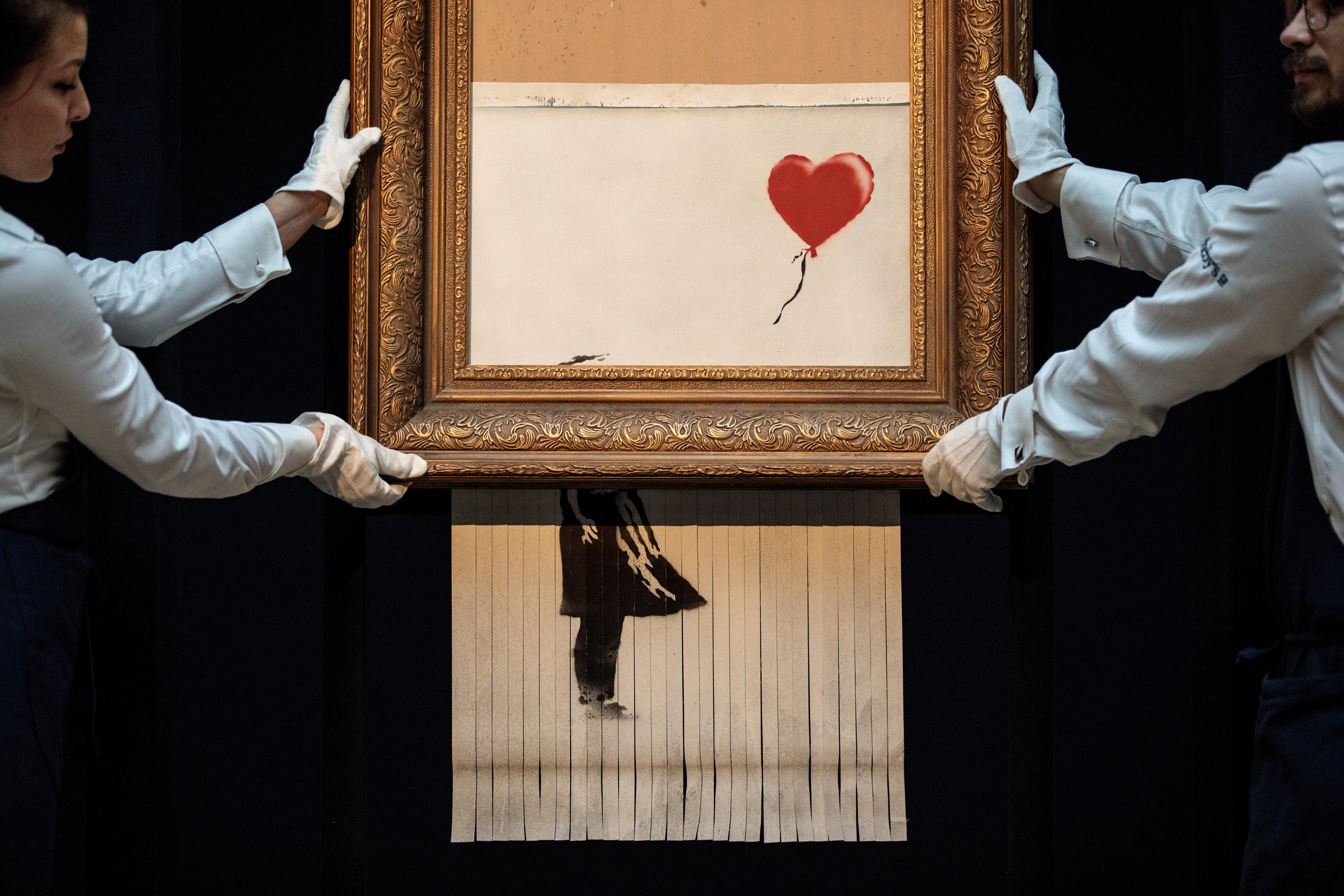 Banksy implies he wanted his partially shredded painting to shred all the way - CBS News4800 x 3200