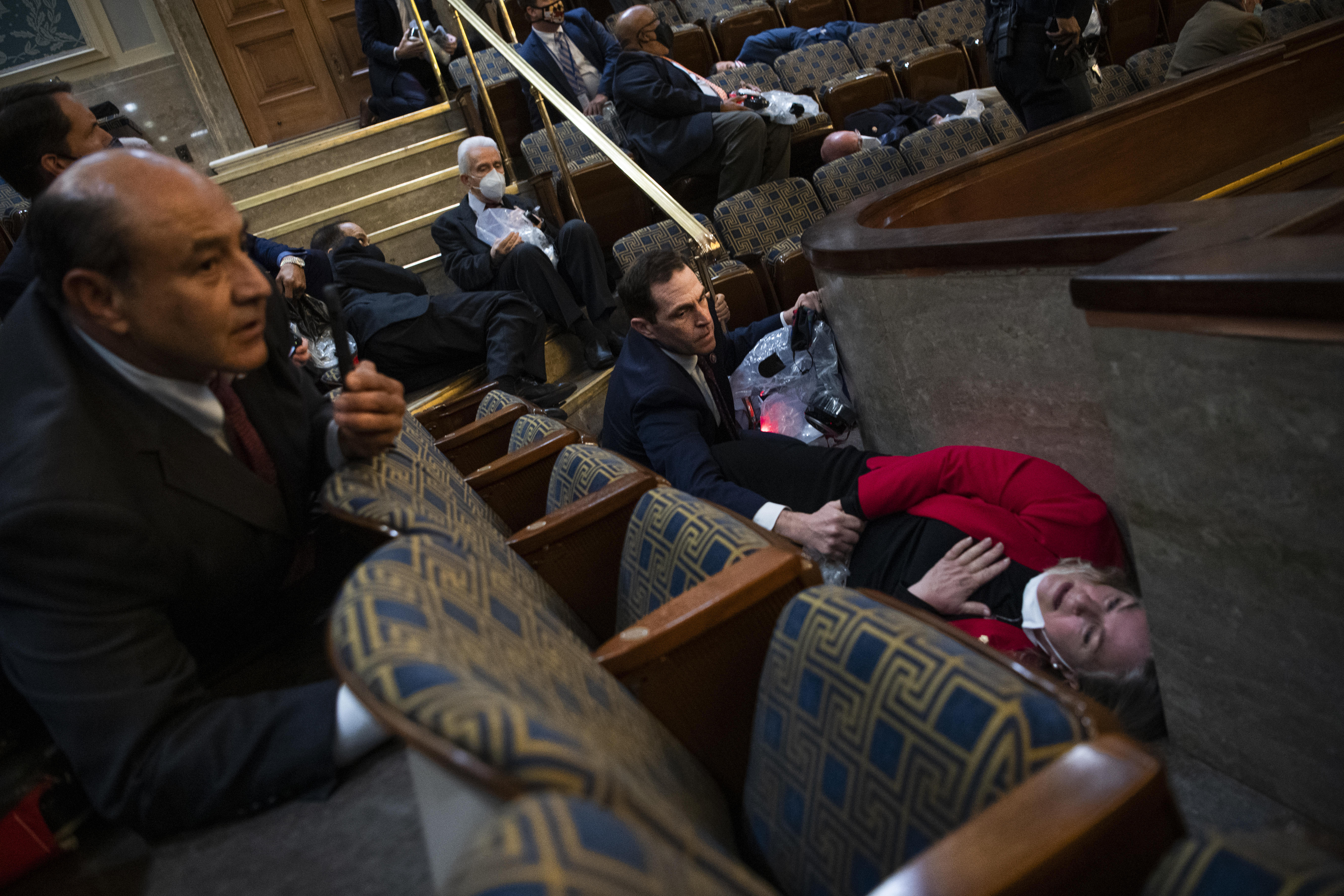 Lawmakers in dramatic photo of Capitol siege recount scene 