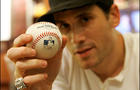 Fashion designer Marc Ecko poses with Barry Bonds' record-breaking home run baseball Monday, Sept. 17, 2007, in New York. 