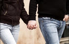 young people holding hands 