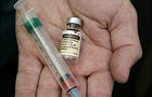 Gardasil, human papillomavirus vaccine, held in hand 