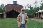 Actor Paul Newman gestures as he arrived at "The Hole in the Wall" camp in Ashford, Conn. 