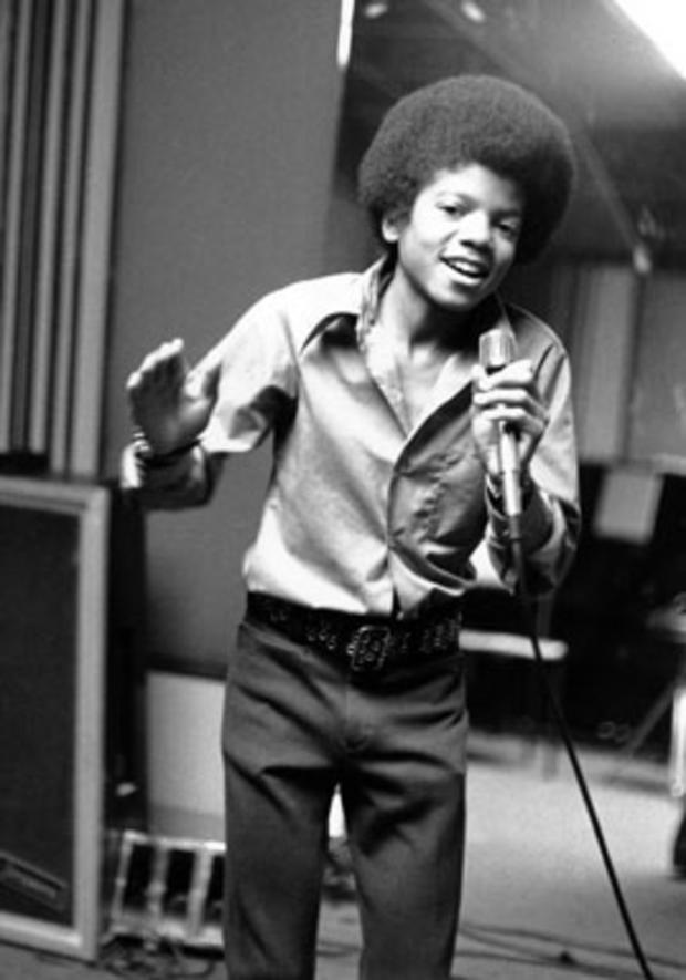 Singer Michael Jackson is shown in 1972, at age 13, the youngest member of the singing group Jackson Five, sings in his home in Encino, Ca. (AP Photo, file) 