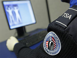 A Transportation Security Administration officer views a full-body scan during a demonstration of passenger screening technology, Wednesday, Dec. 30, 2009, at the TSA Systems Integration Facility in Arlington, Va.