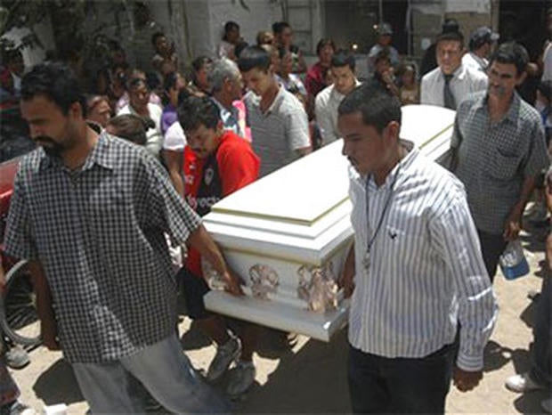 Friends and relatives of Sergio Adrian Hernandez Huereka, 15, carry his coffin before his burial in the northern border city of Ciudad Juarez, Mexico, Thursday June 10, 2010. A U.S. Border Patrol agent fatally shot Hernandez Monday after a group trying to