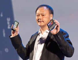 HTC CEO Peter Chou shows the new Desire HD, left, and Desire Z, at their launch in London.