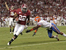 Alabama's Mark Ingram (22) carries on a first-quarter touchdown as Florida's Jeremy Brown (8) defends in an NCAA college football game at Bryant-Denny Stadium in Tuscaloosa, Ala., Saturday, Oct. 2, 2010.