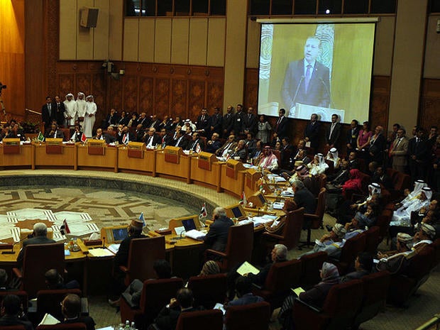 Turkish prime minister Recep Tayyip Erdogan is seen on a screen as he gives a speech to the Arab league members during an Arab league meeting in its headquarters in Cairo, Egypt, Sept. 13, 2011.