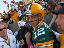 GREEN BAY, WI - OCTOBER 2: Aaron Rodgers #12 of the Green Bay Packers exits the stands after scoring a touchdown against the Denver Broncos at Lambeau Field on October 2, 2011 in Green Bay, Wisconsin. (Photo by Matt Ludtke /Getty Images)