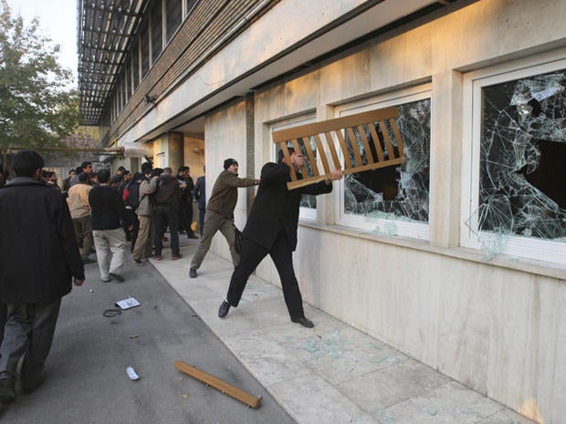 Iranian protesters break the windows of a British Embassy