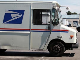 U.S. Postal Service trucks are seen parked near the loading dock at the U.S. Post Office sort center Aug. 12, 2011, in San Francisco.