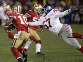 Kyle Williams fumbles as he is hit by Jacquian Williams