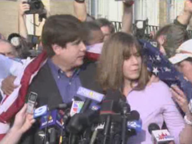Blagojevich Supporter Drapes Him With The U.S. Flag 