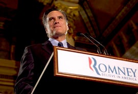 Gov. Mitt Romney pauses while speaking at a primary election night rally