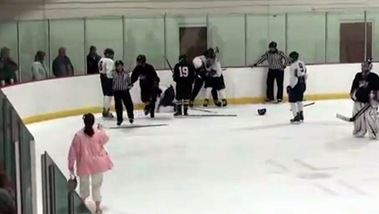 Watch Hockey mom storms the ice during fight CBS News