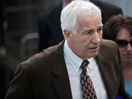 Former Penn State assistant football coach Jerry Sandusky leaves the Centre County Courthouse after the fourth day of his child sex abuse trial June 14, 2012, in Bellefonte, Pa.