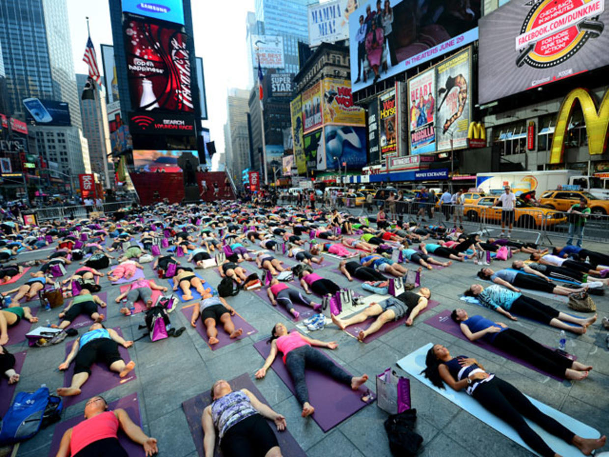 Yoga takes over Times Square for summer solstice CBS News