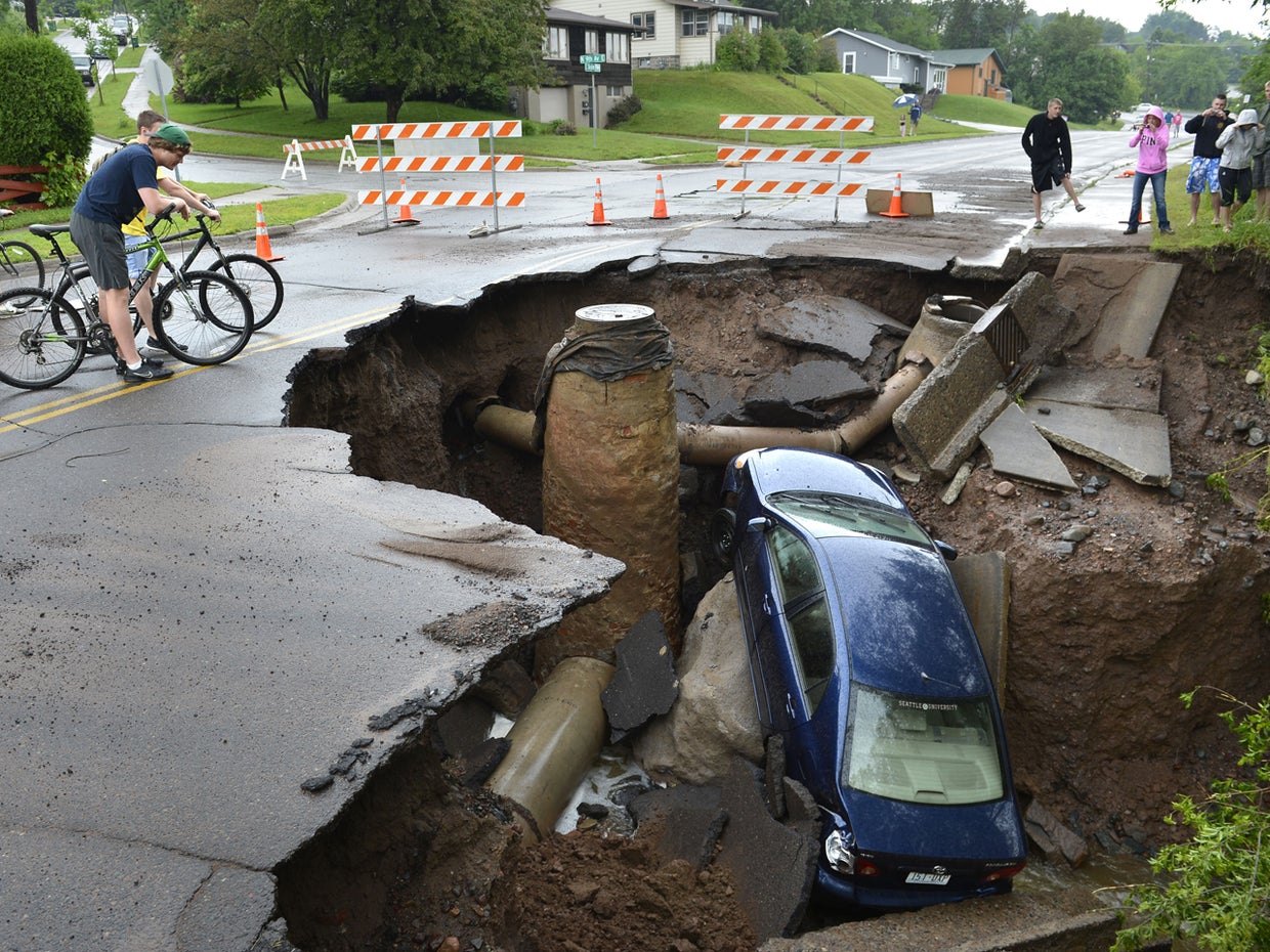 Giant sinkholes CBS News