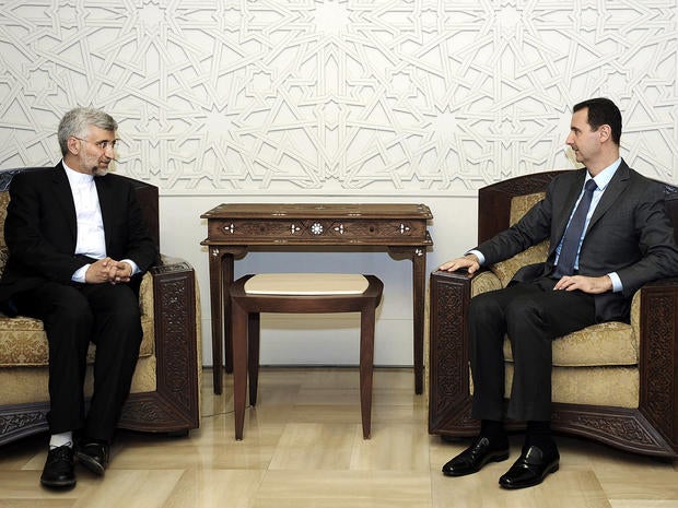 Syrian President Bashar Assad meets with senior Iranian envoy Saeed Jalili in Damascus, Syria, Aug. 7, 2012, in this photo released by the Syrian state-run news agency SANA.