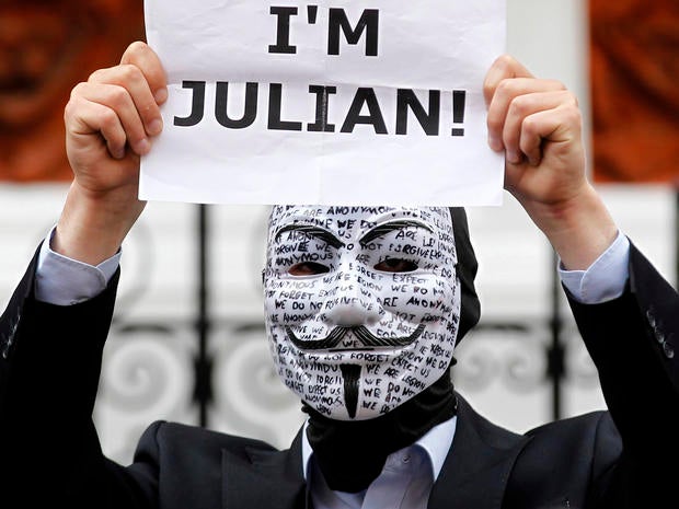 A supporter of WikiLeaks founder Julian Assange holds up a placard outside the Ecuadorian Embassy in London Aug. 16, 2012.