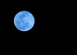 This photo of a blue moon was taken from Boca Raton, Fla., on New Year's Eve 2009. Blue moons aren't actually blue-hued, though that's not to say humans haven't seen blue and even green moons.