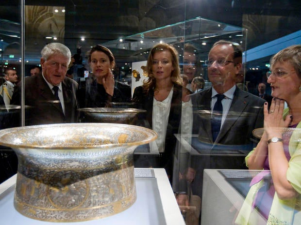 French President Francois Hollande looks at the Saint Louis baptistery