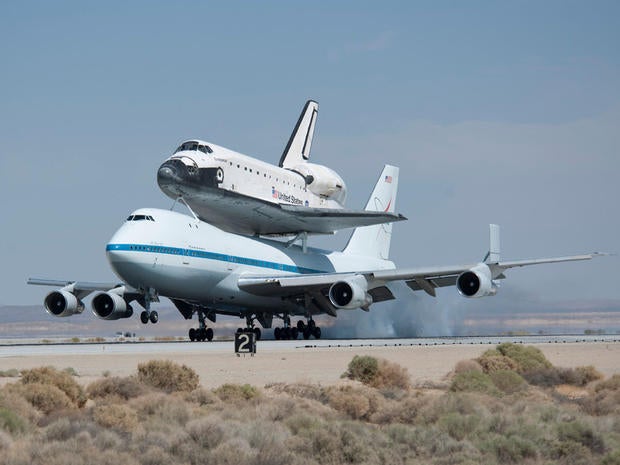 NASA's Shuttle Carrier Aircraft with the space shuttle Endeavour securely mounted on top touches down at Edwards Air Force Base after third leg of its four-segment final ferry flight from the Kennedy Space Center in Florida to Los Angeles International Airport on Sept. 20, 2012. The landing was preceded by a spectacular low-level flyby of NASA Dryden Flight Research Center and the Edwards flight line flown by NASA Dryden pilot Bill Brockett. Photo Credit: (NASA/Tom Tschida)