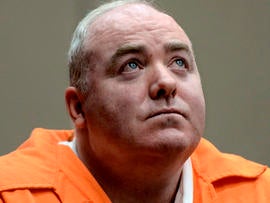 Michael Skakel looks up while listening to a statement from John Moxley, unseen, brother of victim Martha Moxley, in court in Middletown, Conn., Jan. 24, 2012.