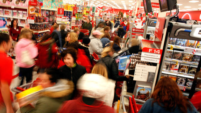 Shoppers race around a Target store as they start the traditional holiday shopping frenzy on Black Friday, Nov. 28, 2008, in Pleasant Prairie, Wis. 
