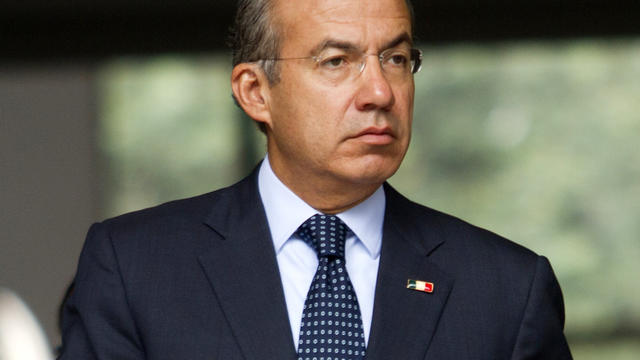 Mexican President Felipe Calderon arrives at a press conference at his official residence in Mexico City Oct. 10, 2012. 