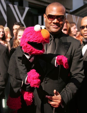 Elmo puppeteer resigns amid sex allegations CBS News