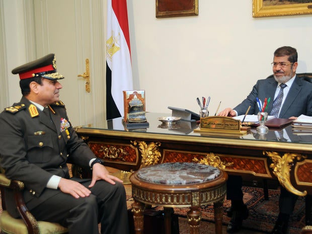 President Mohammed Morsi, right, meets Lt. Abdul Fattah El-Sissi