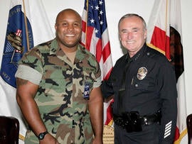 This undated photo released by the Los Angeles Police Department shows suspect Christopher Dorner, a former Los Angeles officer with former Police Chief William Bratton.