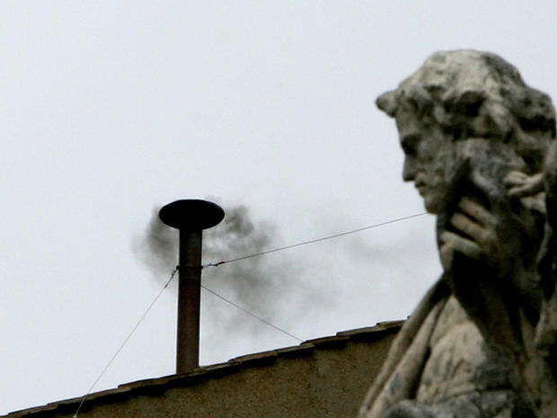 Black smoke rises from the Sistine Chapel chimney during the 2005 conclave. 