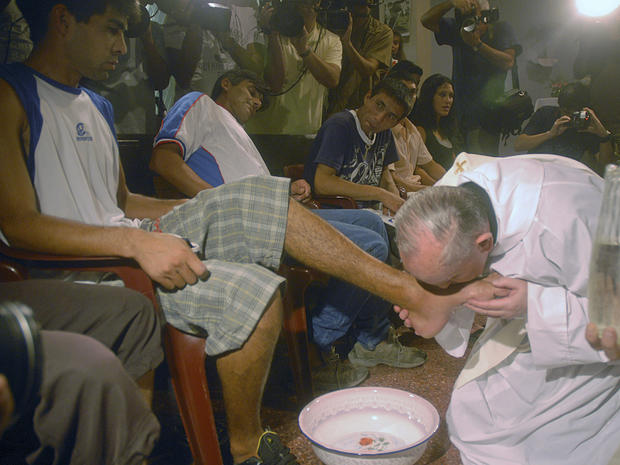 In this picture taken March 20, 2008, Pope Francis, at the time Cardinal Jorge Bergoglio, kisses the feet of a man during a mass with youth trying to overcome drug addictions in Buenos Aires, Argenti 