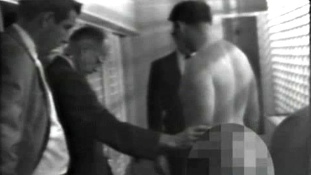 James Earl Ray, the man who assassinated Martin Luther King in 1963, is stripped search by police.