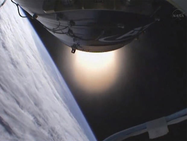 The Antares second-stage solid-fuel motor fires to push a dummy payload into orbit.