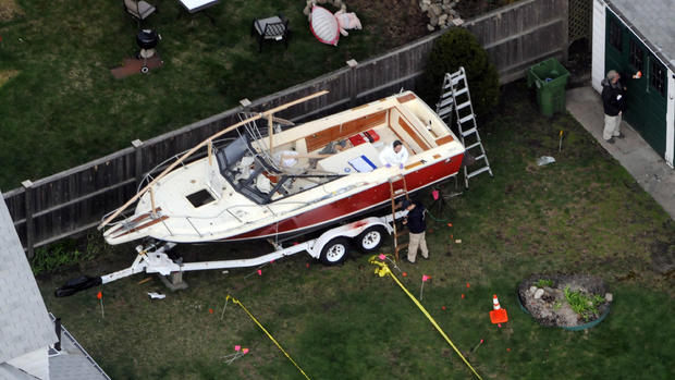 Boston bombing suspect found hiding in boat 