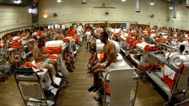 This picture, taken in 2006, shows prisoners being held in tight quarters in a gymnasium. The California Department of Corrections says they no longer house prisoners at this location.;
