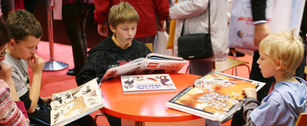 Children read books at the International header 610 