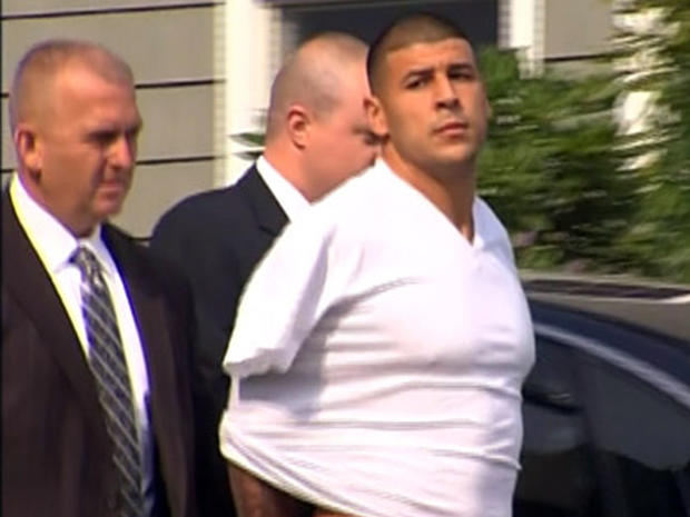 New England Patriots tight end Aaron Hernandez is led away by police June 26, 2013, in North Attleborough, Mass. 