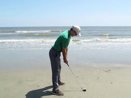 Luke Bielawski's last shot, with a biodegradable golf ball, sunk into the Atlantic.