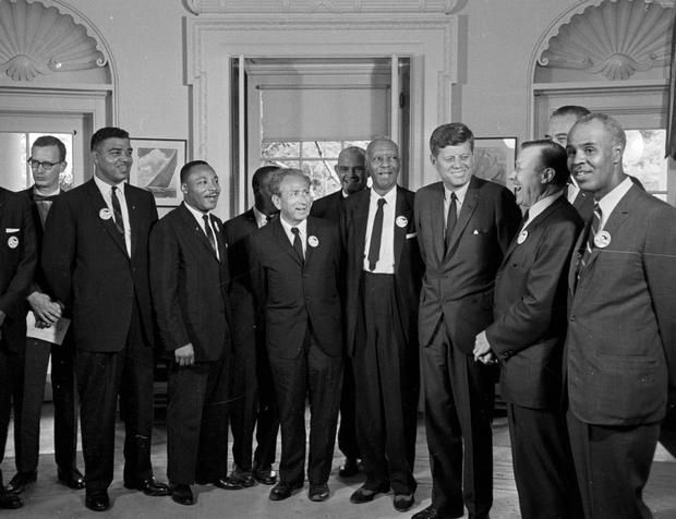 President Kennedy stands with a group of leaders of the March on Washington 